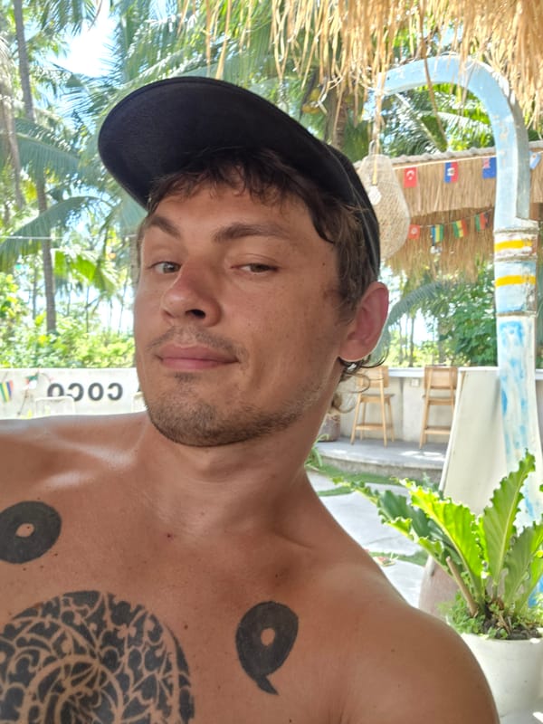 Tattooed man photographed multiple times in Nusa Penida