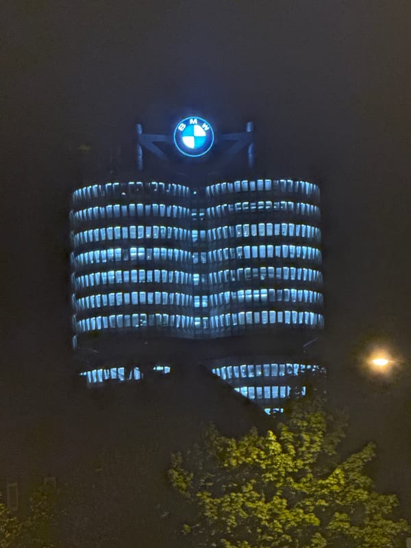 BMW Munich headquarters glows blue at night