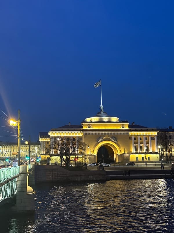 Saint Petersburg evening streetscapes capture illuminated Winter Palace area