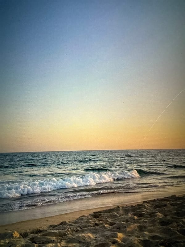 Beach memories: woman in water, painted nails, coastal scene