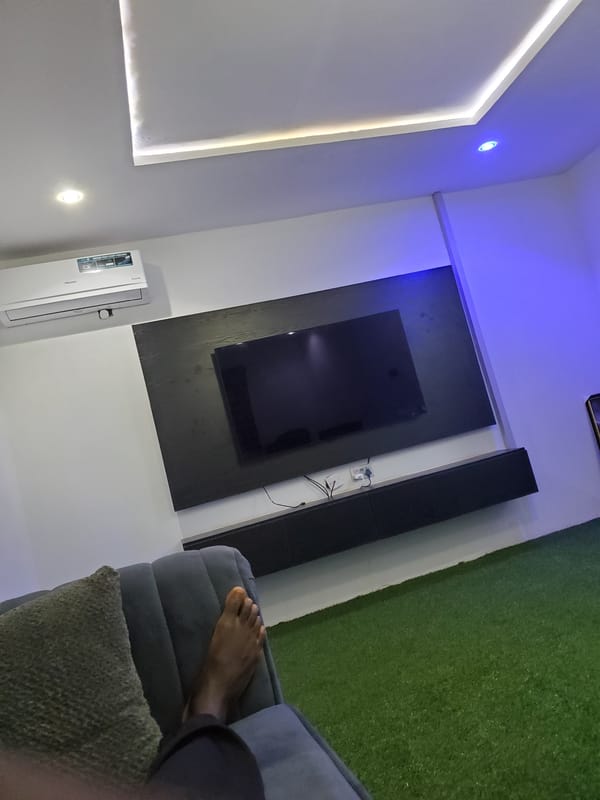 Modern living room with LED-accented entertainment setup documented