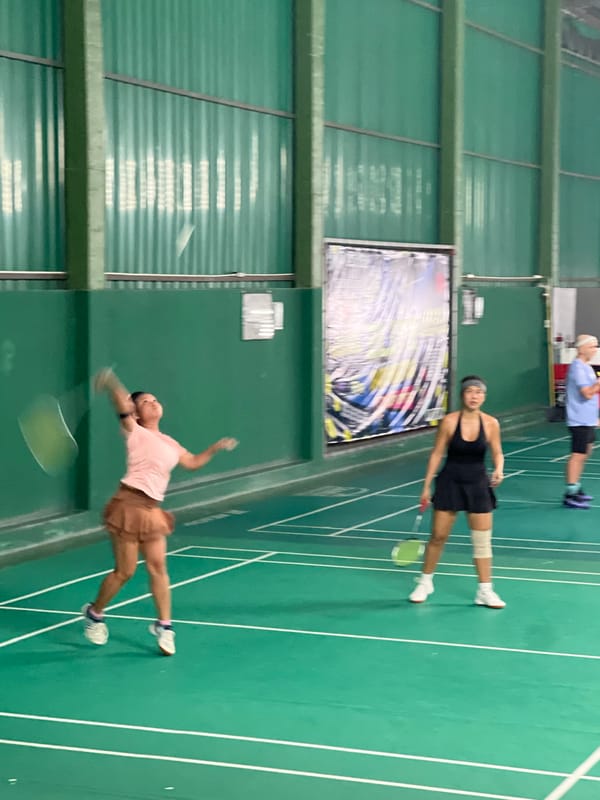 Badminton tournament organized at indoor court in Thailand