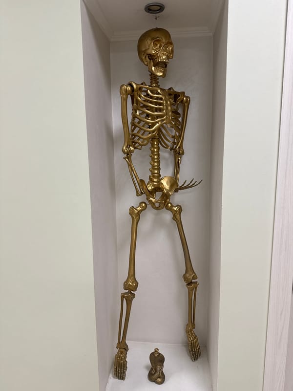 Inside an ornate Khimki metro station with a golden skeleton display