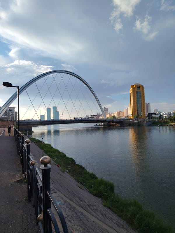 Astana's Ishim riverfront on a busy summer afternoon