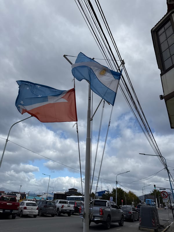 Argentine flags displayed on street pole in Ushuaia