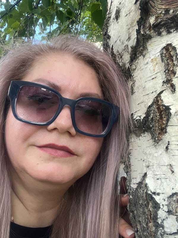 Woman with purple hair photographed by birch tree in Izhevsk