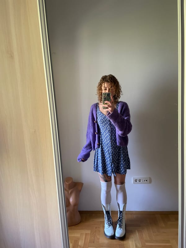 Woman takes mirror selfies in blue floral dress, Montenegro