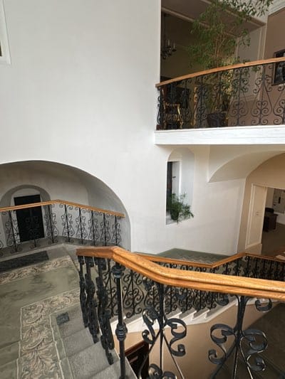 Person walks down ornate staircase in historic Kyiv building