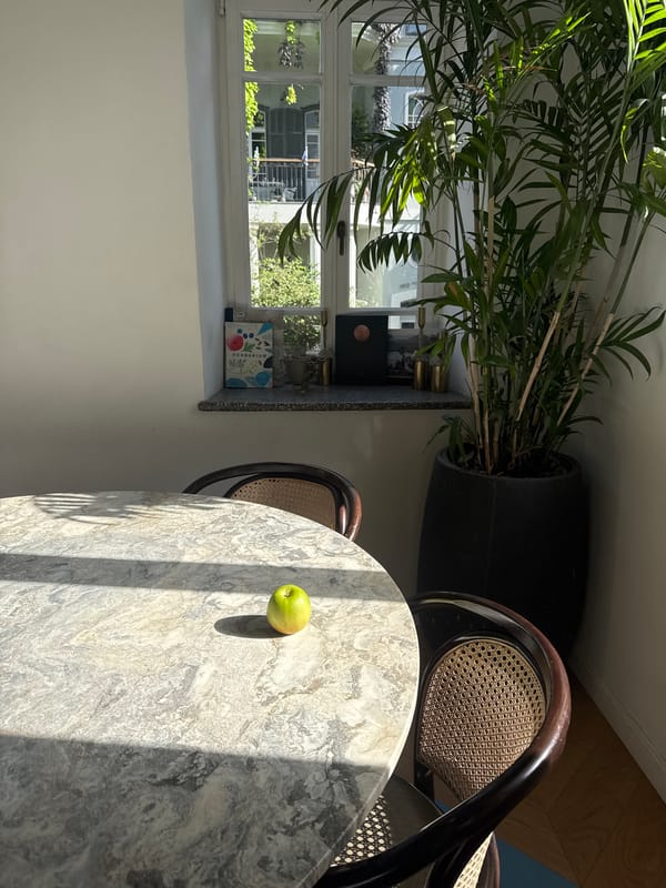 Green apple on marble table captured in Tel Aviv interior