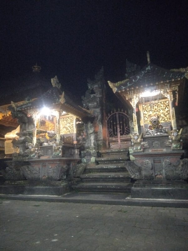 Nighttime documentation of illuminated Balinese Hindu temple architecture