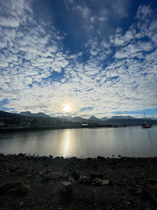 Tourist captures Ushuaia harbor and street scenes on cloudy afternoon