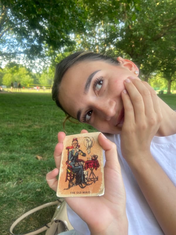 Afternoon picnic in a London park with cards and food