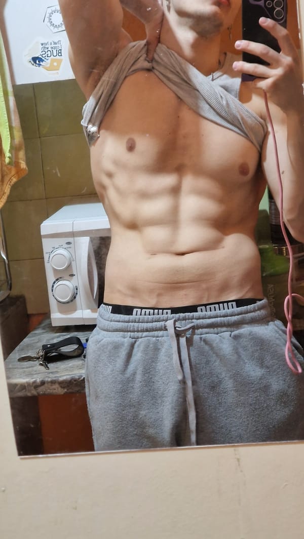 Person takes bathroom selfie wearing athletic wear