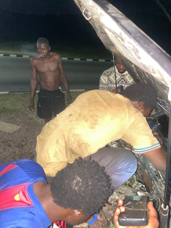 Roadside breakdown and evening highway scenes near Kuje, Nigeria