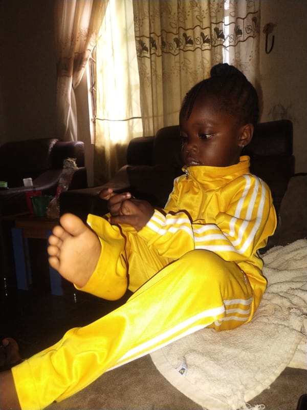 Child resting, damaged phones documented in Jos Nigeria morning