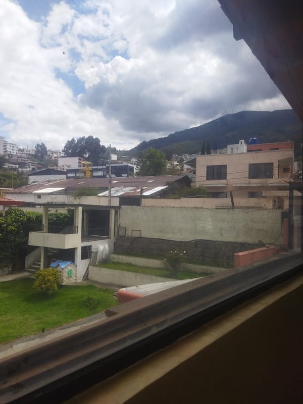 Resident documents everyday city views from Quito building window