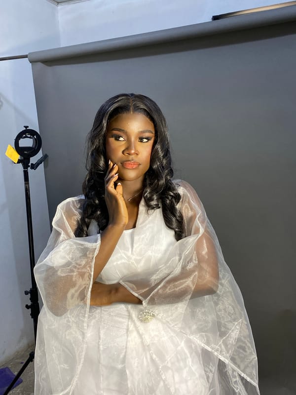 Woman poses for professional photoshoot in Jos studio