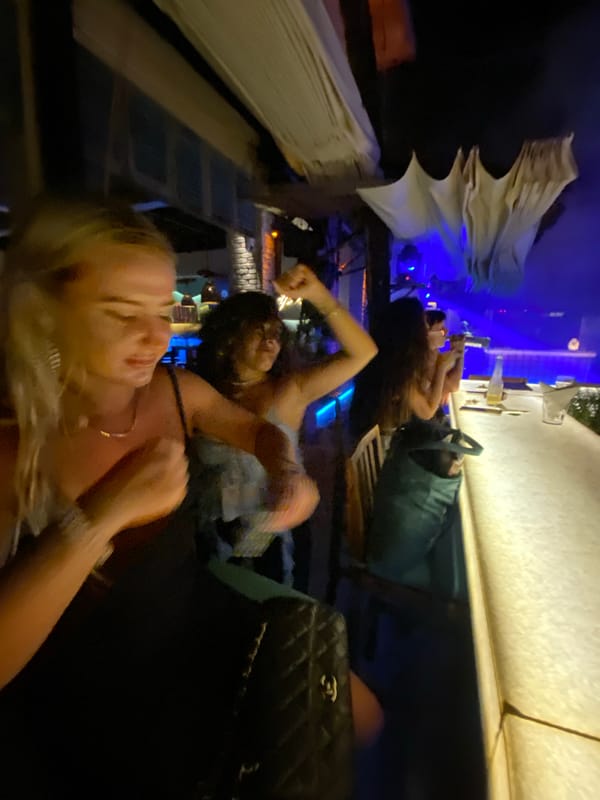 Evening social gathering at tropical-themed nightclub in Vietnam