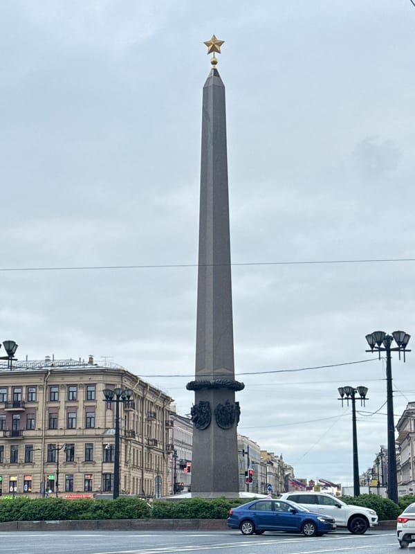 Tourist captures Palace Square monuments and LED advertising truck