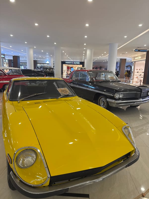 Vintage car display showcased in mall during early morning hours