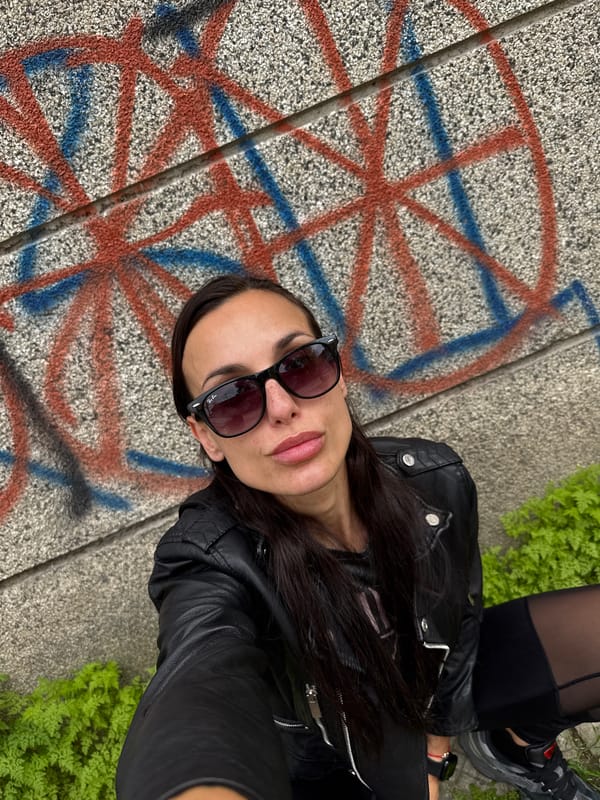 Woman takes selfie by colorful graffiti in Pleven