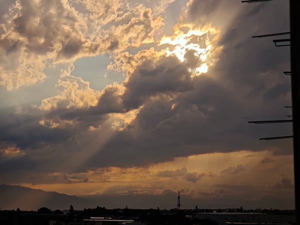 Storm rolls over Tbilisi with rain shafts and dramatic golden light