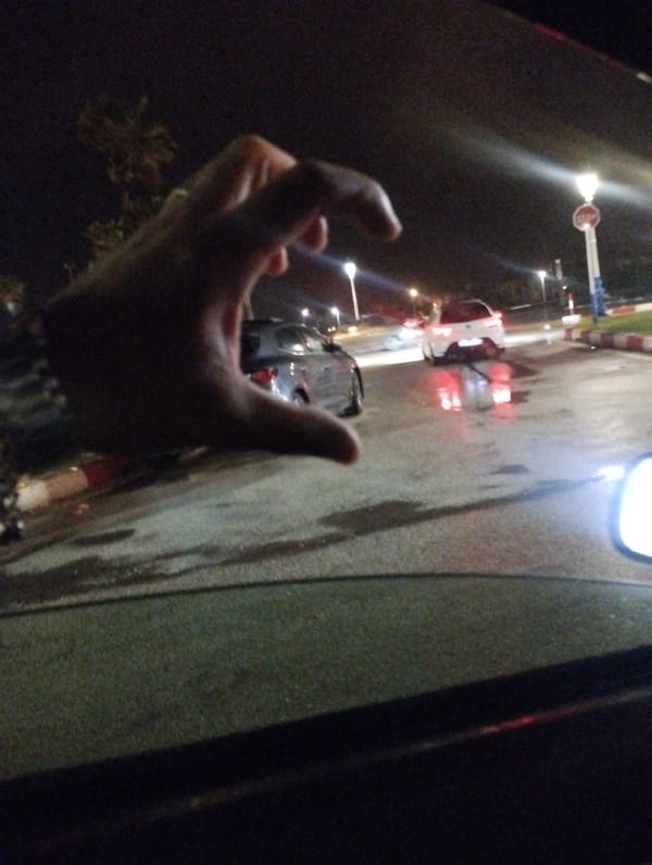 Friends share intimate car ride moments during rainy night in Martil