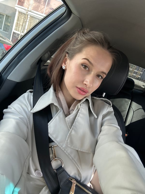 Woman takes car selfies in Yekaterinburg apartment district