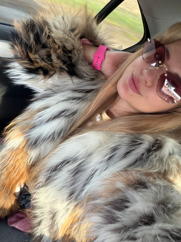Woman takes selfie in car in Az'mushkino, Russia