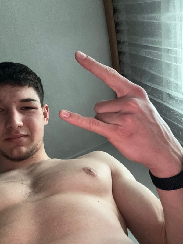 Young man takes flexing selfies indoors in Zlatograd
