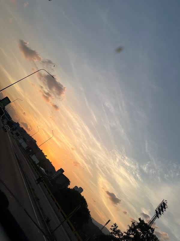 Sunset observed over Caracas highway showing colorful sky gradient