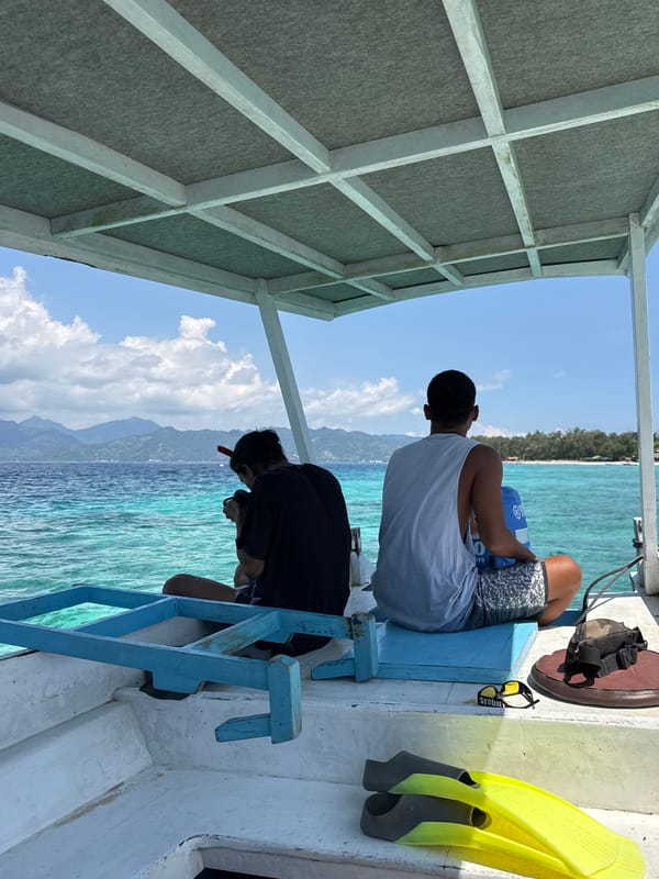 Two people enjoy boat trip off Indonesian coast