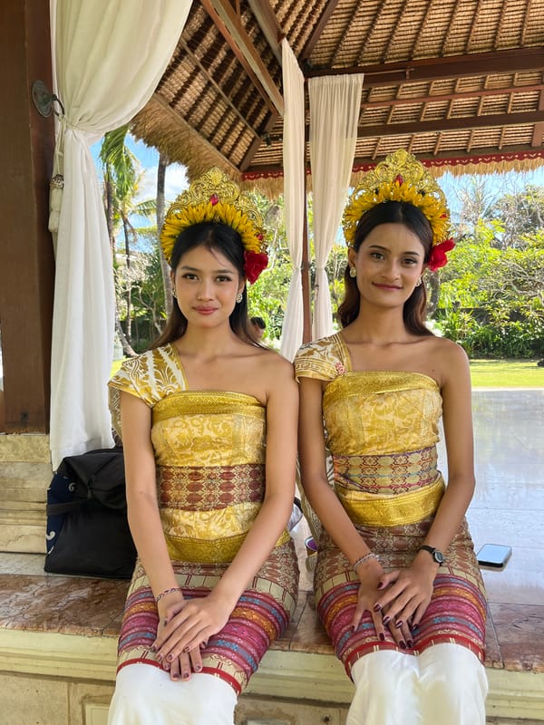 Balinese ceremony, beach sculpture, and tropical fruit in Kuta Selatan