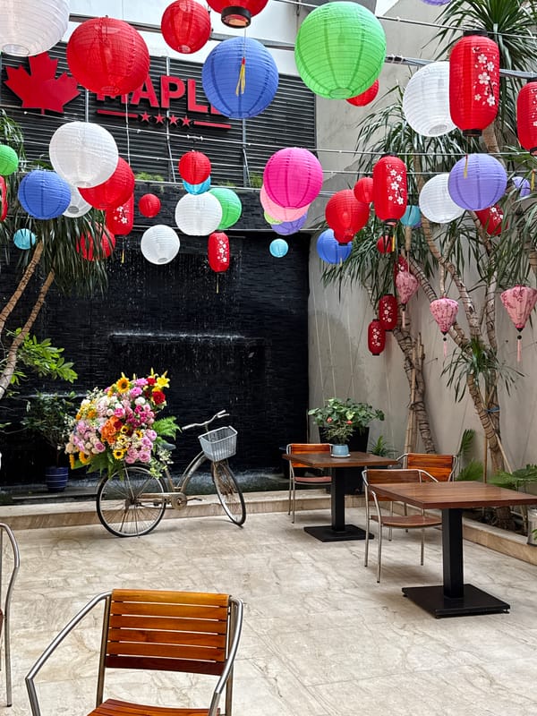 Decorated cafe and narrow alleyway documented in Nha Trang