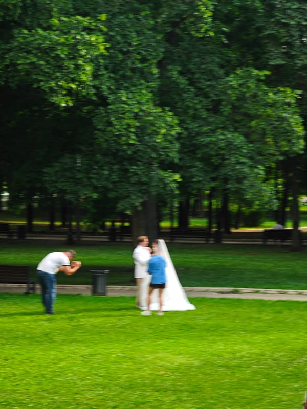 Wedding and bold architecture in a Moscow summer afternoon