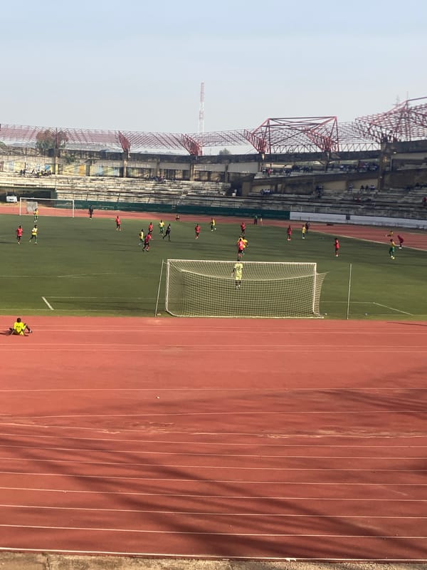 Soccer match and fan activity at New Stadium Nigeria