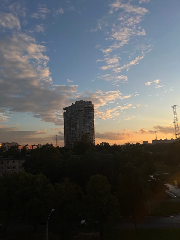 Saint Petersburg residential outskirts glow under a summer sunset