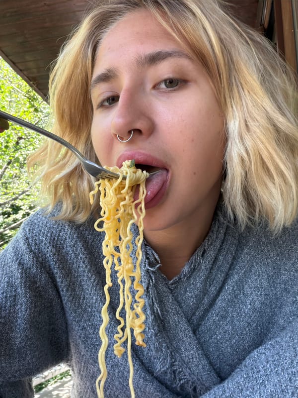 Balcony morning in Tbilisi: noodles, Coke, and video editing