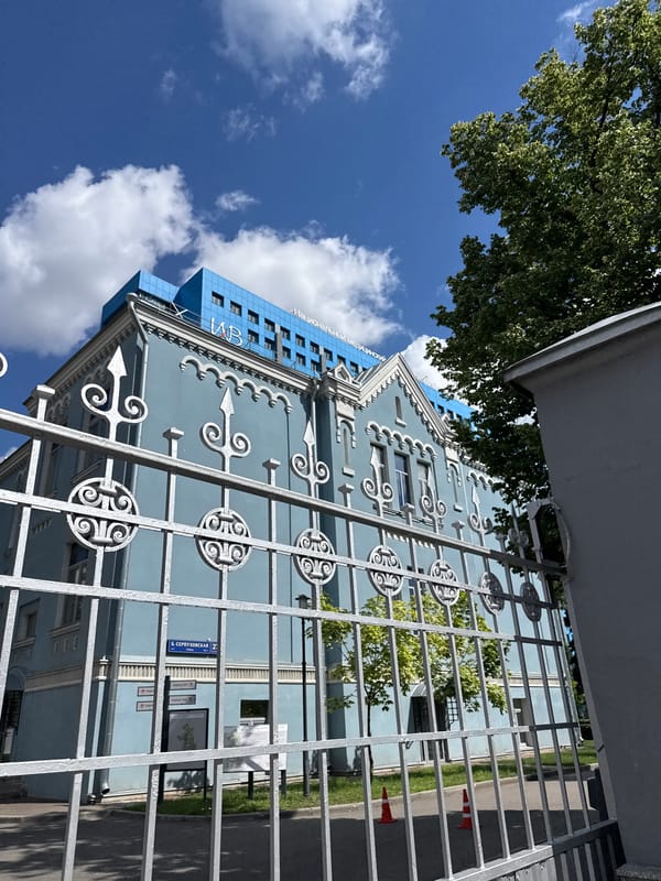 Classical pale blue building with modern addition, Moscow