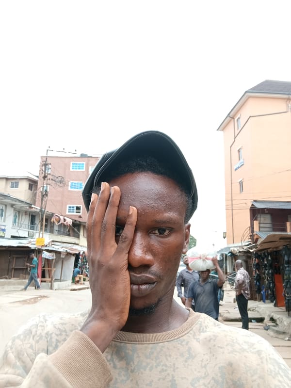 Young man records street selfies in Onitsha, Nigeria