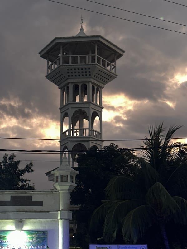 Indonesian minaret and beachside recreation area documented by witness