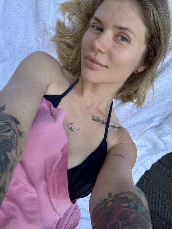 Woman enjoys poolside leisure time in rural Russia