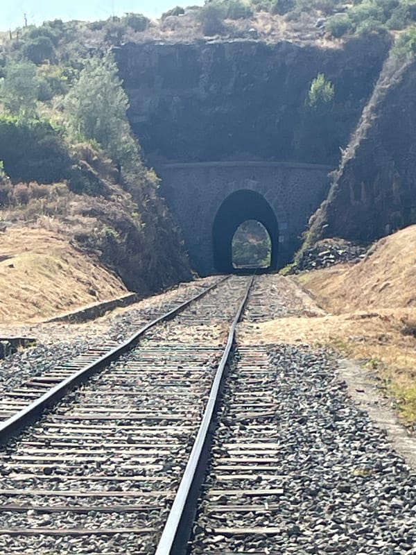 Walking an old railway tunnel trail on a clear sunny day