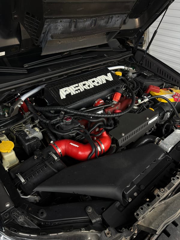 Professional car detailing session documented in Krasnoyarsk automotive facility