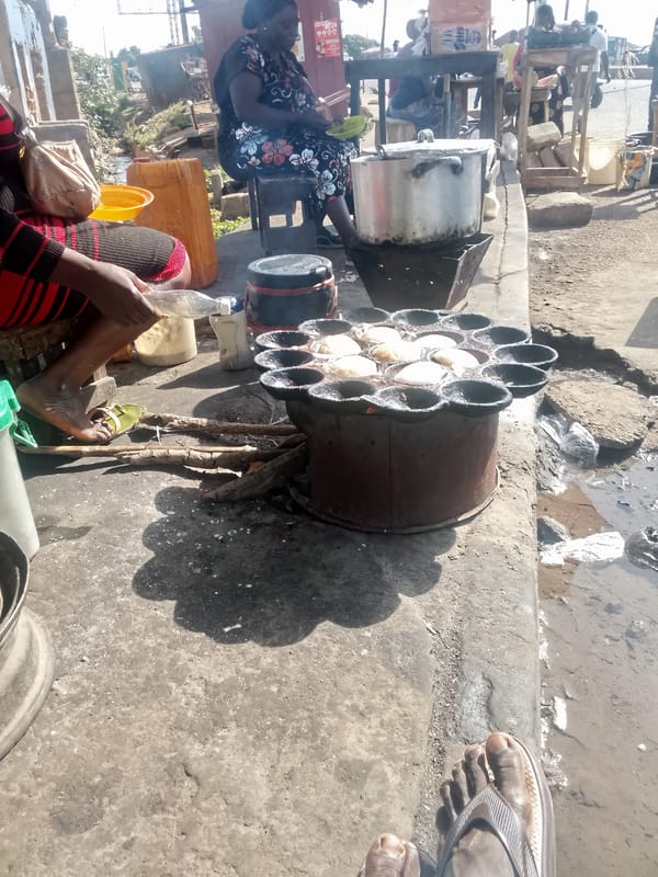 Street food vendors operate morning market scene