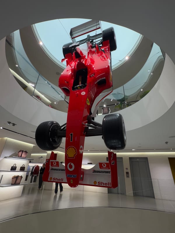 Ferrari F1 car suspended in Milan building display
