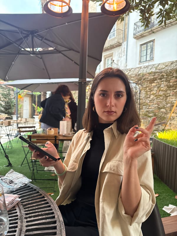 Woman dines at outdoor cafe in Santiago De Compostela