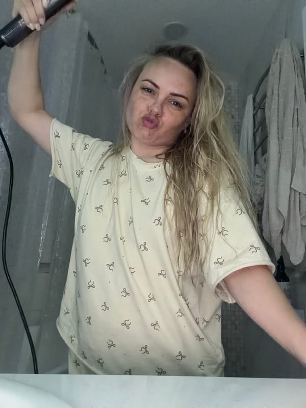 Woman takes selfie with hair dryer in Votkinsk