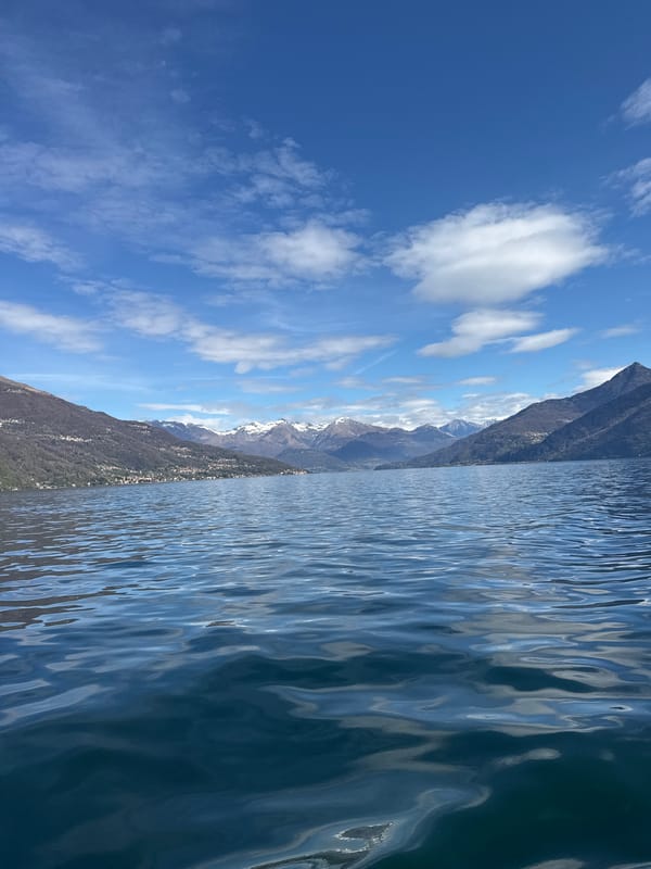 Lake Como viewed from Nobiallo showing rippling waters, mountains