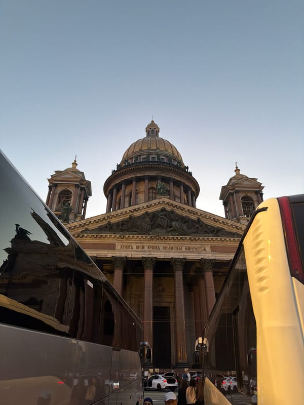 Evening foot traffic around a grand domed landmark